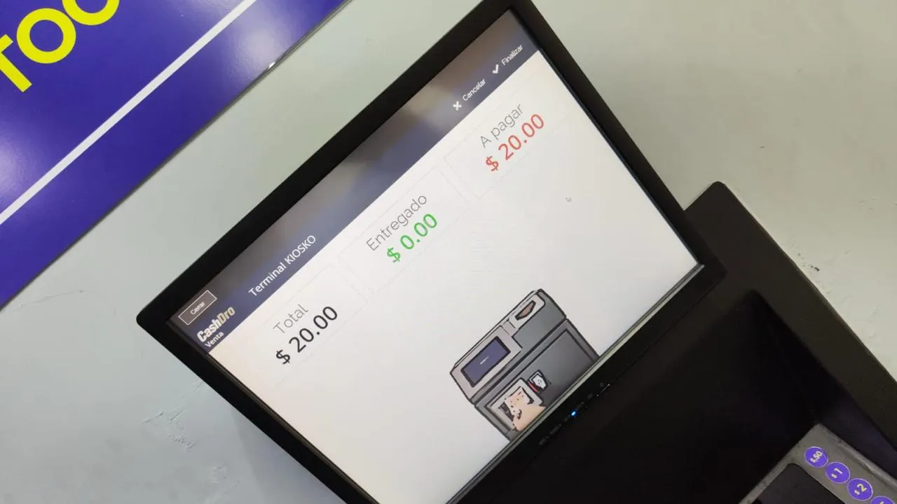 Pantalla de terminal kiosko mostrando total, entregado y cambio de una venta